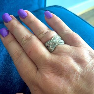 Over 1 carat of round and baguette diamonds set in Sterling Silver. Size 10.